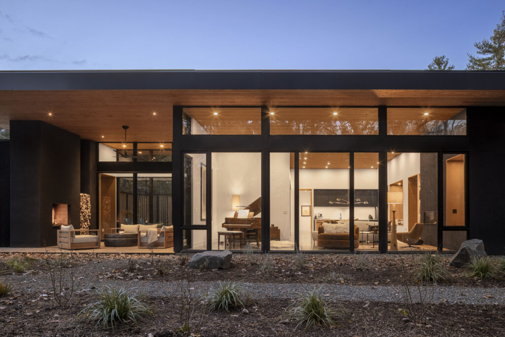 Fermata has a large glass facade that looks out to the forest.