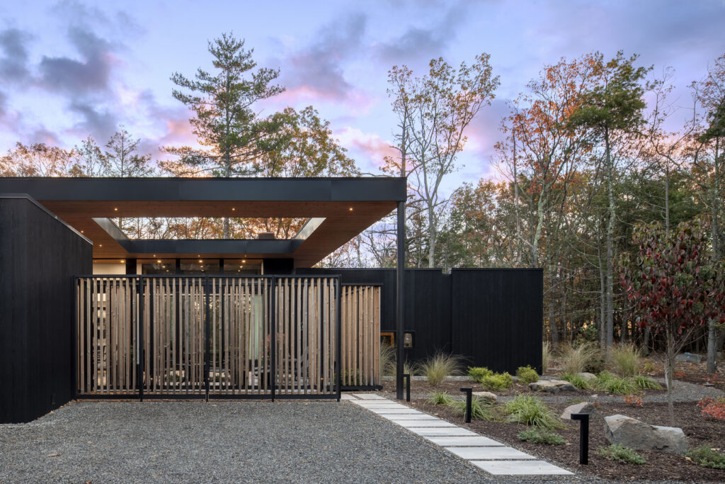 Fermata's screened fence encloses a central courtyard with a roof opening that allows southern light to enter the space.
