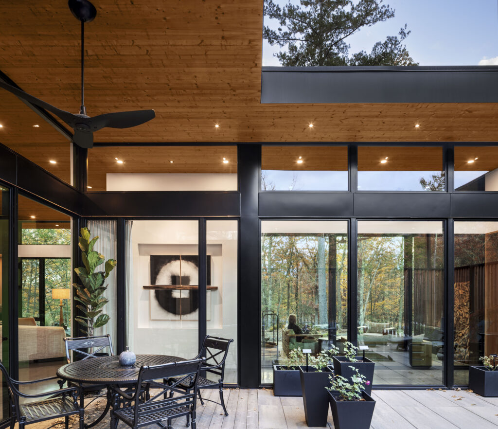 The courtyard at Fermata looks towards the glass hallway.