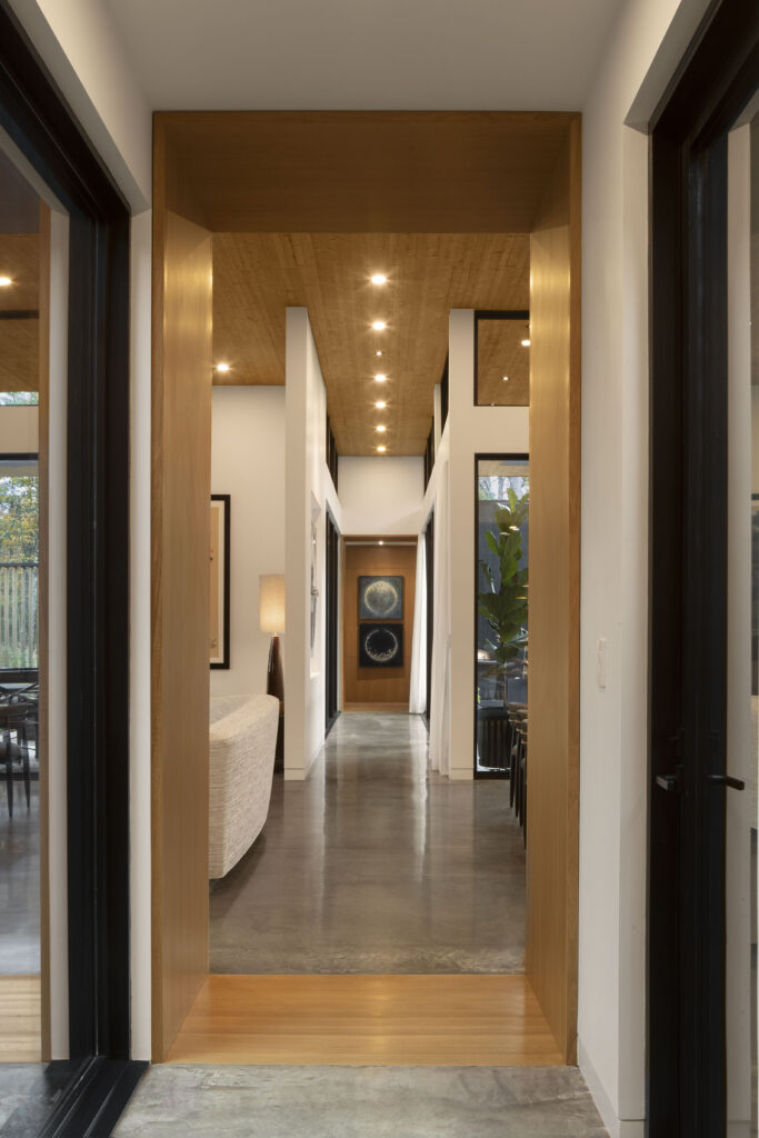 The primary axis at Fermata looks from the guest wing to the main bedroom.